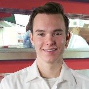 Smiling young man with short dark hair